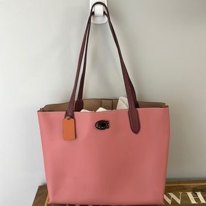 Rose Leather Coach tote with magnetic and toggle closures. Zipper inside pocket.